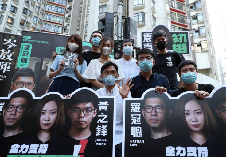 Pro-democracy campaigners pose during the July 2020 primary election in Hong Kong that has irritated Beijing