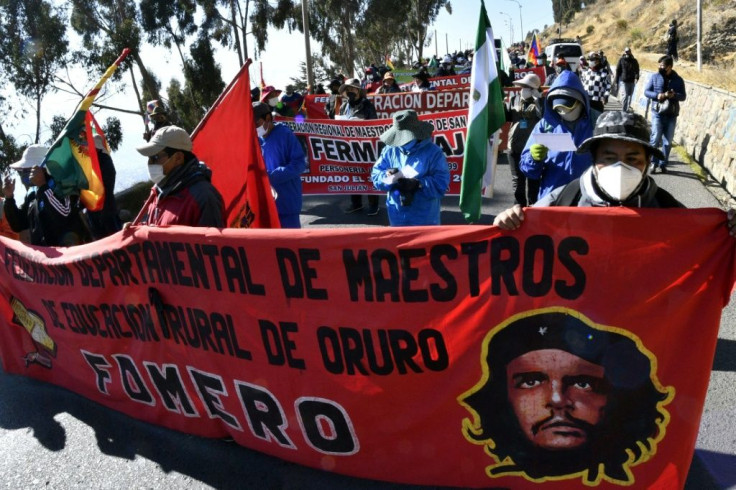 Workers march from El Alto to La Paz to protest the health, education and labor policies of Bolivian President Jeanine Anez's right-wing government
