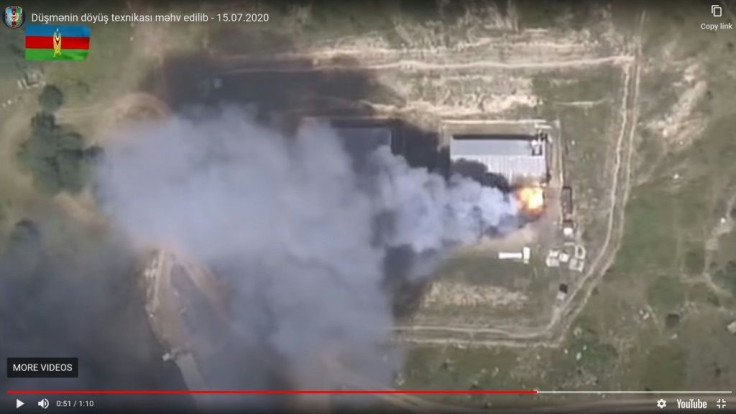 An image grab taken from a video uploaded on YouTube by the Azerbaijani Defence Ministry on July 15, 2020, allegedly shows smoke billowing from what they said was destroyed Armenia's military equipment on the Azerbaijani-Armenian border