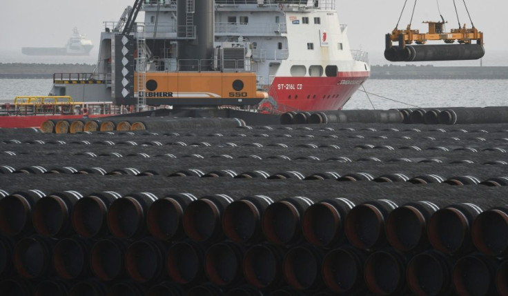 Tubes for the construction of the Nord Stream 2 pipeline, which the United States wants to stop, are loaded on a ship at the Mukran port in Sassnitz on the Baltic Sea island of Ruegen in northeastern Germany in December 2019