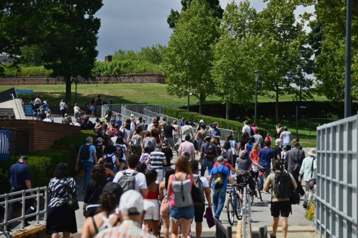 Tourists visit Governors Island in New York Harbor after it reopened to visitors