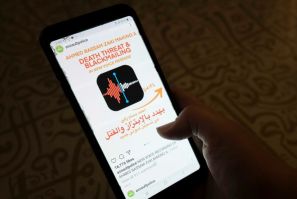 A woman in Egypt checks an Instagram account for reporting allegations of sexual harassment and misconduct