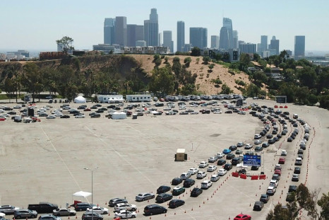 An aerial view shows a long line of cars at a COVID-19 testing site at Dodgers Stadium in Los Angeles, California, on July 15, 2020