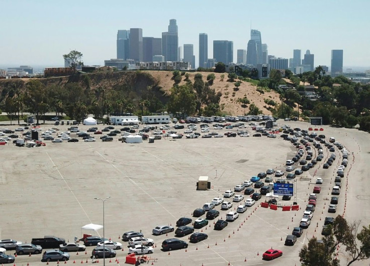 An aerial view shows a long line of cars at a COVID-19 testing site at Dodgers Stadium in Los Angeles, California, on July 15, 2020