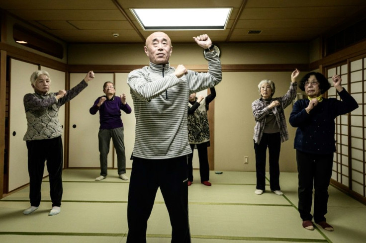 Therapist Taisuke Kasuya (C), a judo black belt, says judo therapy "works on both your body and your mind"