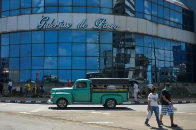 A group of people gather outside of a mall in Havana July 16, 2020 during the coronavirus pandemic