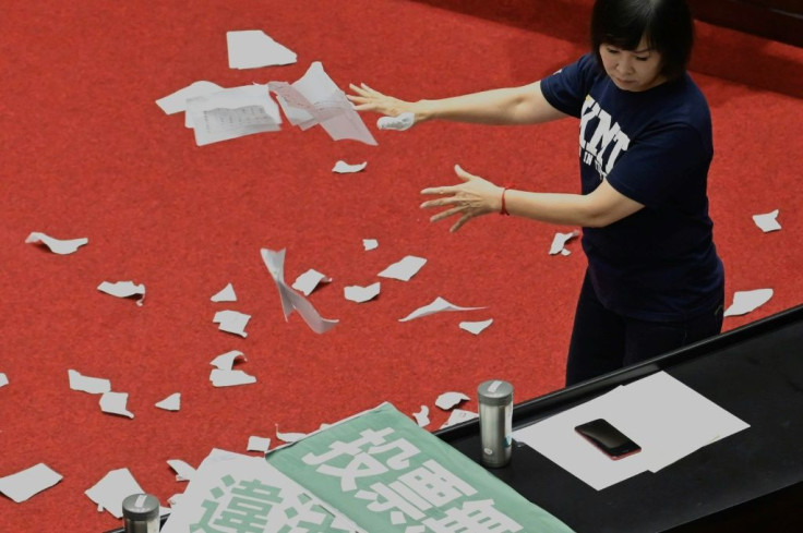 Lu Yu-ling from the KMT tears up ballots as the party protests against the Control Yuan nomination