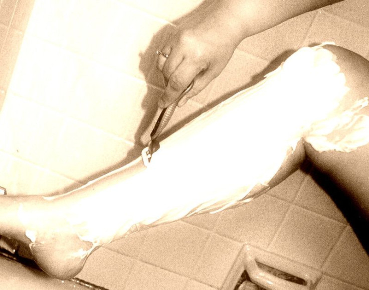 shaving woman legs shaving cream