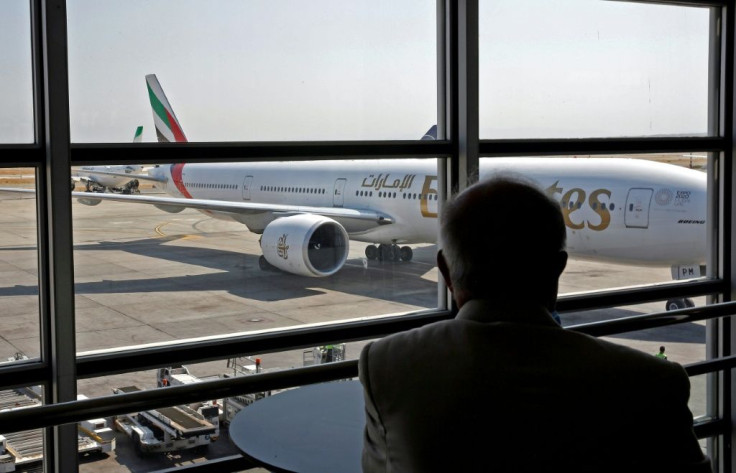 An Emirates aircraft begins disembarking passengers at the Iranian capital airport