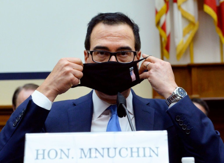 US Treasury Secretary Steven Mnuchin puts on his face mask after testifying before the House Small Business Committee