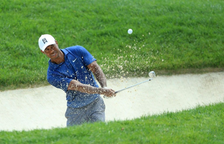 Tiger Woods blasts out of a bunker in the second round of the US PGA Tour Memorial tournament