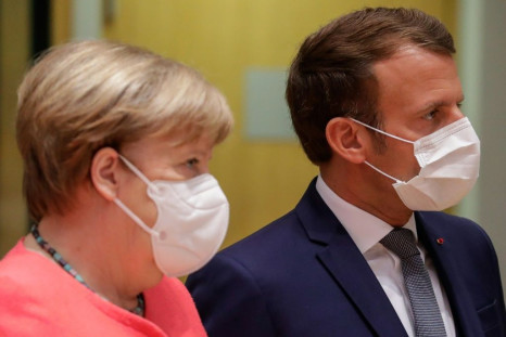Germany's Chancellor Angela Merkel (L) and France's President Emmanuel Macron were described as looking annoyed after they left a late night meeting with the Netherlands' Prime Minister Charles Rutte