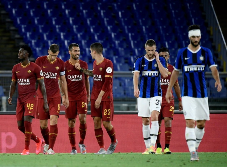 Roma's Leonardo Spinazzola (3rd L) celebrates after scoring aginst Inter Milan at the Olympic Stadium in Rome.