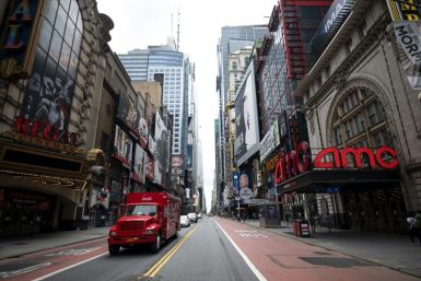 A truck drives along normally bustling 42nd Street in Manhattan on June 30, 2020