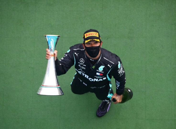 Reaching for the top: Lewis Hamilton dominated in Hungary and is closing in on Michael Schumacher's victory record