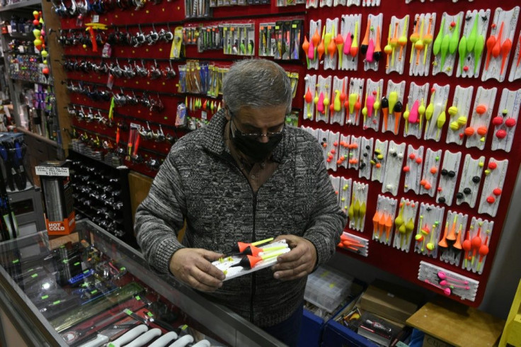 A salesman checks a floating fishing tackle for sale at a his store, after lockdown measures to fight COVID-19 were relaxed in Buenos Aires