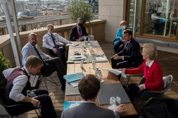 Meeting as 27 around  a single table proved unwieldy, so European Council President Charles Michel (2nd L), often invited smaller groups of leaders onto his roof terrace to break down details of the huge post-virus rescue plan