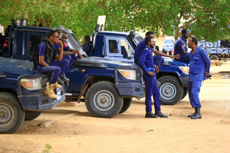 Members of the Sudanese security forces deploy outside a court in Khartoum prior to the trial of Sudan's ousted president Omar al-Bashir