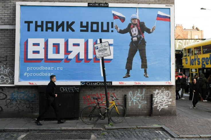 A Brexit-themed billboard depicting Britain's former foreign secretary Boris Johnson waving Russian national flags reading "Thank you Boris"