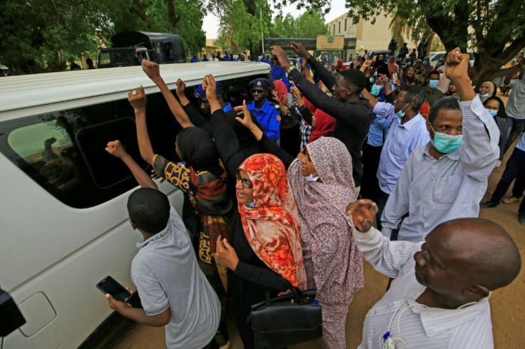 A vehicle carrying Bashir leaves the Khartoum courthouse in the Sudanese capital