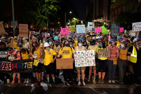 Mothers form the front line of a protest march on July 20, 2020 in Portland