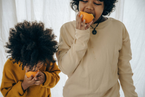 hungry-ethnic-kids-with-fresh-fruit-in-studio-4546113