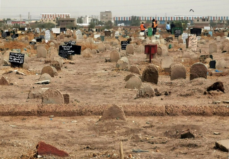 Members of a forensic team at a first mass grave found south of Khartoum in June