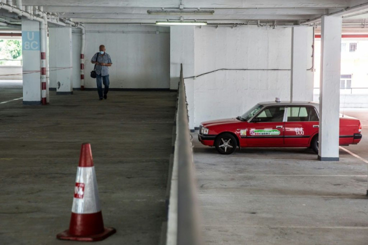 A taxi driver arrives to get tested for the coronavirus at a makeshift testing station in Hong Kong