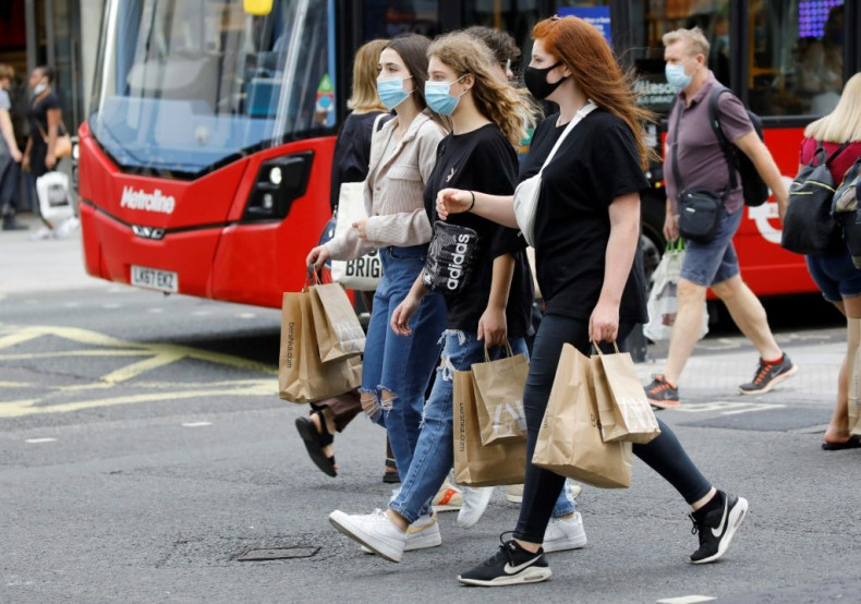 Shoppers wear face masks on Oxford Street in London after face coverings became mandatory in shops and supermarkets in Britain