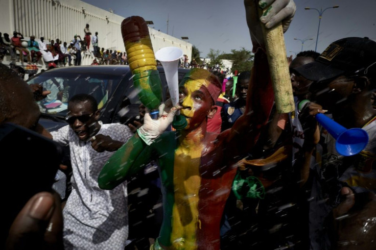 A man painted in the colours of Malian flag at a demonstration last month in Independence Square in Bamako