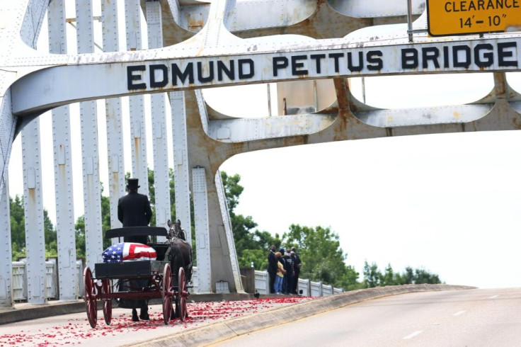 In a solemn tribute, a horse-drawn wagon carried the body of civil rights leader and longtime congressman John Lewis across the Edmund Pettus Bridge in Selma, Alabama, on July 26, 2020; he was badly beaten on the bridge during a 1965 rights march