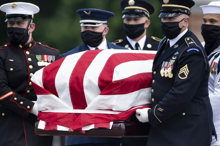 The flag-draped casket of civil rights icon John Lewis is carried by an honor guard to lie in state in the Capitol rotunda