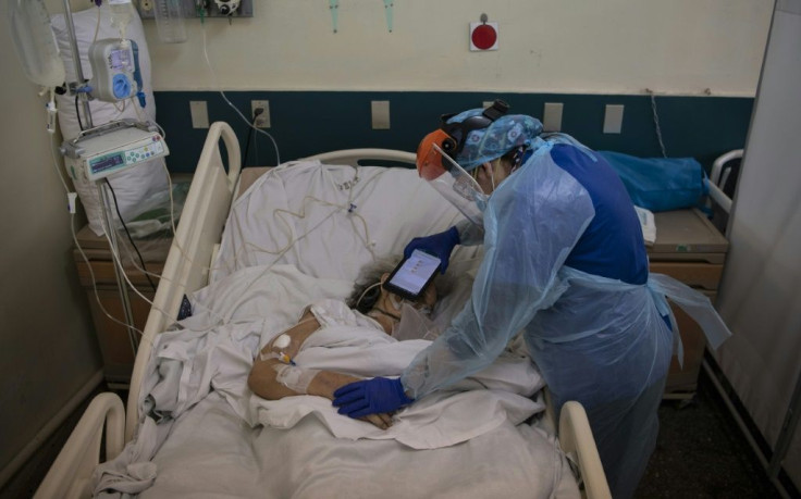 Dr Moyra Lopez uses a tablet to pass on video and audio messages or play music to dying patients