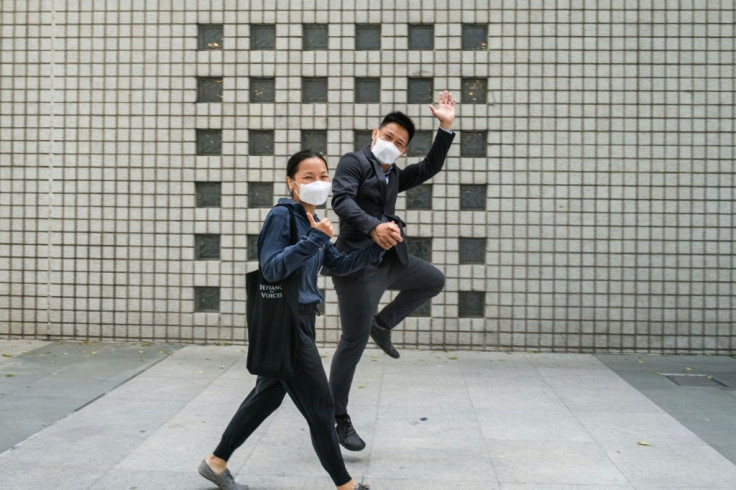 To (left) and Tong (right) leave court after their aqcuittal on riot charges