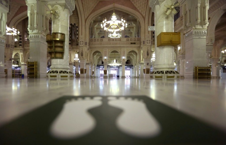 Stickers indicate safe distance spots amid the COVID-19 pandemic on the floor of the Grand Mosque in the holy city of Mecca