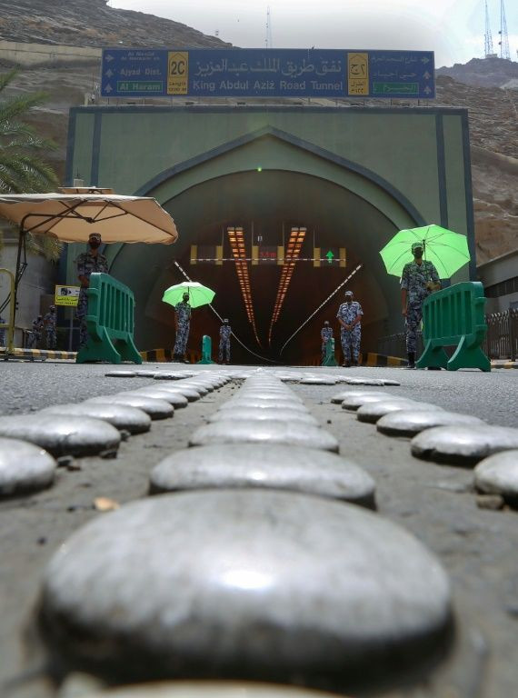 Saudi police man a checkpoint at the entrance of a tunnel leading to the Grand Mosque in the holy city of Mecca