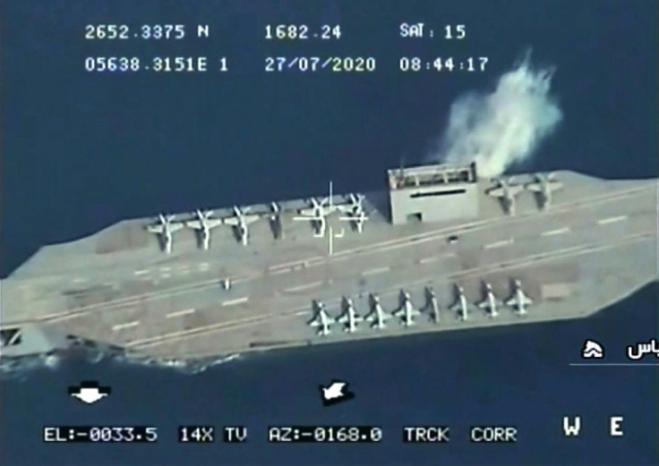 An image grab from Iranian State TV IRIB footage reportedly shows an Iranian mockup of a US aircraft carrier being hit during a military exercise