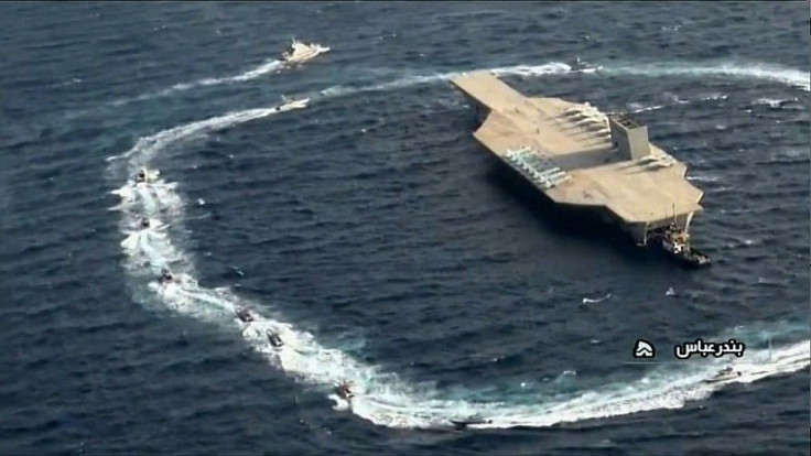 An image grab shows the dummy carrier being encircled by speedboats of Iran's Revolutionary Guards