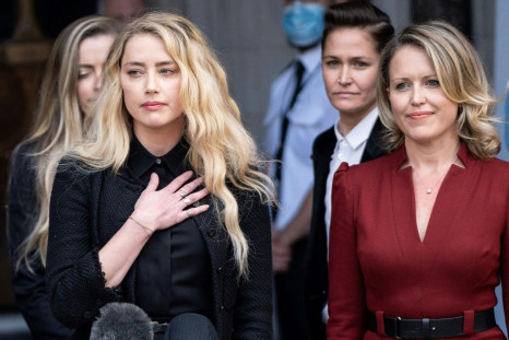 'It has been incredibly painful to relive the breakup of my relationship,' Amber Heard told reporters outside court