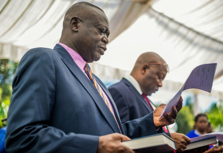 Shiri, left, taking his oath of office as agriculture minister in December 2017