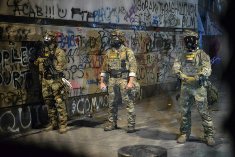Federal officers pictured in Portland, Oregon on July 25, 2020 -- the city has been rocked by weeks of clashes between demonstrators and law enforcement