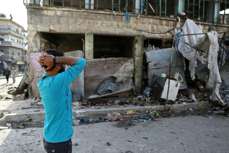People gather in May 2019 at the site of an air strike on a market in the town of Maaret al-Numan, an attack that the United States has cited to impose new sanctions