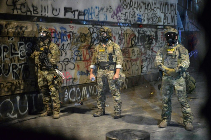 Federal officers are pictured in Portland, Oregon on July 25, 2020 -- the city has been rocked by weeks of clashes between demonstrators and law enforcement