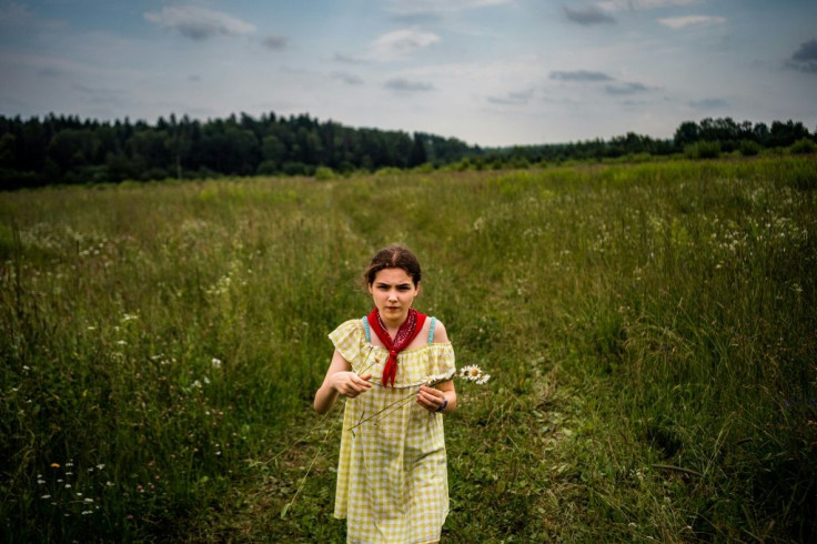 Instead of lazing on European beaches, Muscovites who fled to summer homes are watching Soviet-era films and learning about the healing properties of wild plants