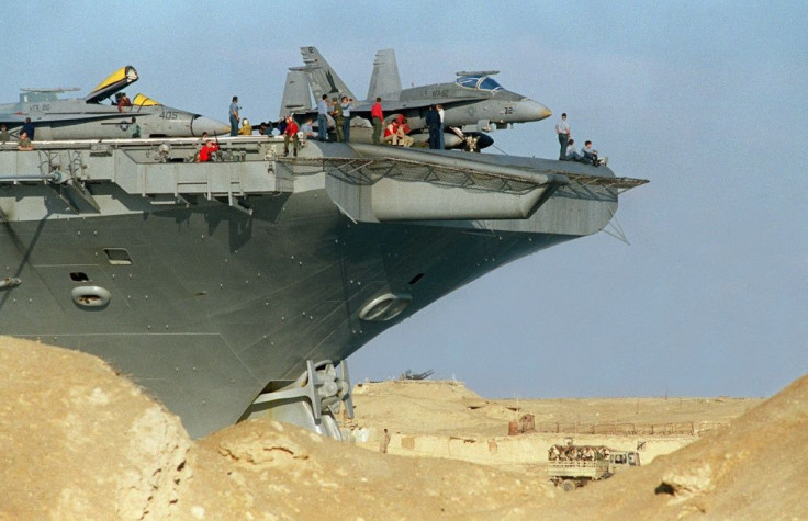 Aircraft carrier USS America traverses the Suez Canal on its way to the Red Sea to take part in the Gulf War, in January 1991