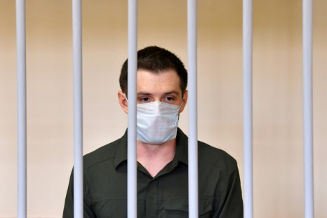 US ex-marine Trevor Reed appeared in a cage for defendants in a courtroom in the Russian capital as the judge read out the guilty verdict