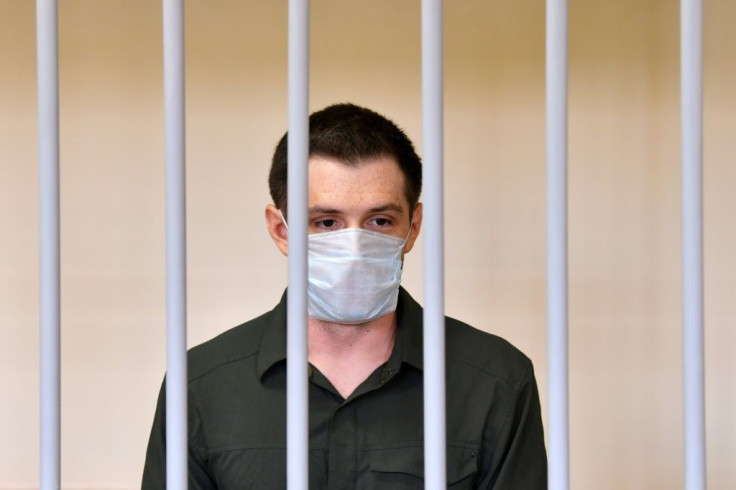 US ex-marine Trevor Reed appeared in a cage for defendants in a courtroom in the Russian capital as the judge read out the guilty verdict
