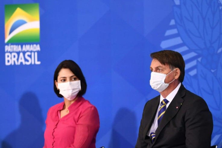 Brazilian President Jair Bolsonaro and the first lady Michelle Bolsonaro attend the launch of the Rural Women's Rights program at Planalto Palace in Brasilia, on July 29, 2020