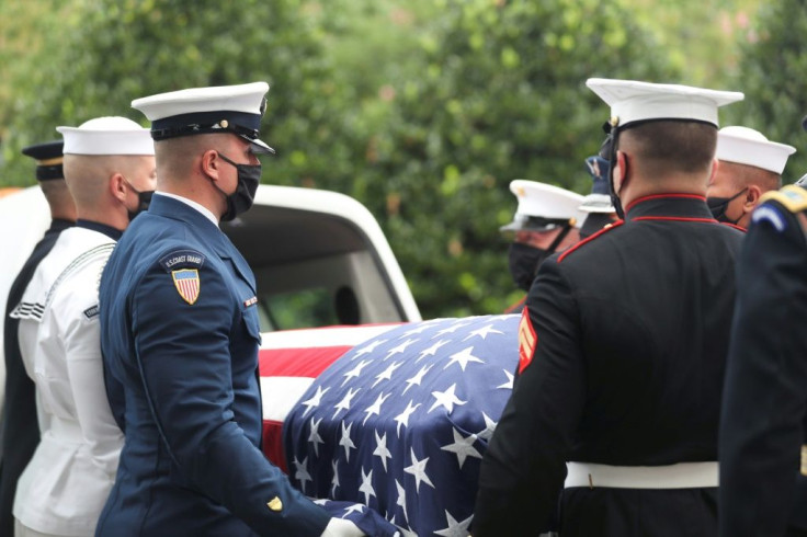 A military honor guard carries the casket of John Lewis