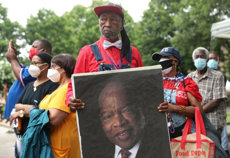 Mourners outside the EbenezerÂ BaptistÂ Church during the funeral service for John Lewis